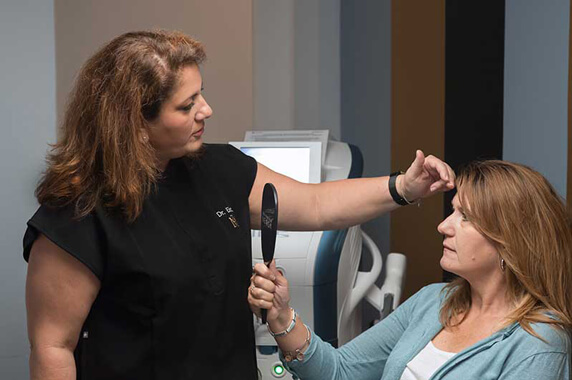 Doctor explaining MediZen treatment to patient