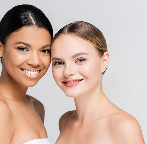 Two woman with fair skin smiling at MediZen Institute