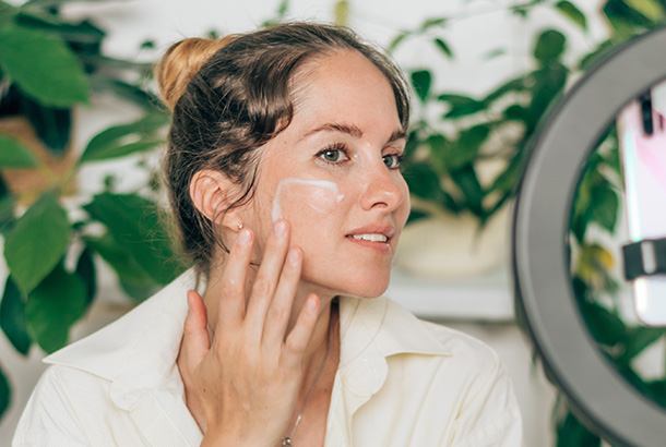 Woman putting some facial cream at MediZen Institute