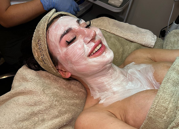 Woman getting a DiamondGlow® treatment at MediZen Institute